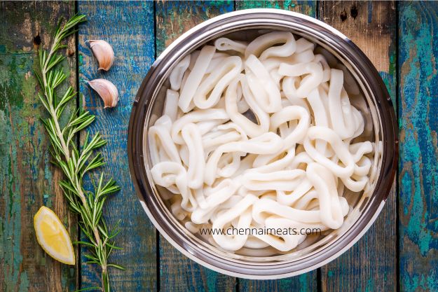 Buy Fresh Raw Calamari Rings Online - fresh raw squid rings in steel bowl on wooden table