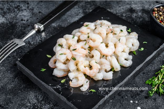 Buy Fresh Seawater White Prawn Medium Deveined - bunch of peeled white shrimps on black bowl
