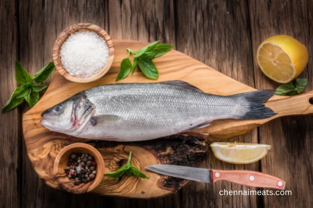 Koduva / Sea bass fish on Wooden Board